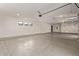 Clean and spacious garage interior with epoxy flooring, bright lighting, and ample room for vehicles and storage at 31226 N Granite Reef Rd, Scottsdale, AZ 85266