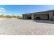 Modern house with a spacious four-car garage and large paved driveway, perfect for car enthusiasts at 31226 N Granite Reef Rd, Scottsdale, AZ 85266