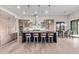 Modern kitchen features a large island with bar stools and stainless steel appliances at 31226 N Granite Reef Rd, Scottsdale, AZ 85266