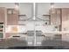 Kitchen features stainless steel appliances, a large island, and floating shelves for a modern, open feel at 31226 N Granite Reef Rd, Scottsdale, AZ 85266