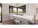 Features a unique design element: a window above the sink that seamlessly connects the indoors with the serene outdoor scenery at 31226 N Granite Reef Rd, Scottsdale, AZ 85266