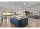 Open concept kitchen with a large island, pendant lighting, and seamless flow to the living space at 31226 N Granite Reef Rd, Scottsdale, AZ 85266