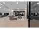 Spacious living room with hardwood floors and view of the desert landscape beyond sliding glass doors at 31226 N Granite Reef Rd, Scottsdale, AZ 85266