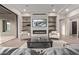 Modern living room with fireplace, built-in shelves, and comfortable seating arrangement at 31226 N Granite Reef Rd, Scottsdale, AZ 85266
