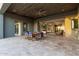 Covered patio includes a dining table and chairs with seamless transition to the living room at 31226 N Granite Reef Rd, Scottsdale, AZ 85266