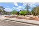 Inviting home featuring a meticulously landscaped front yard with drought-resistant plants and decorative fencing at 313 W Utopia Rd, Phoenix, AZ 85027