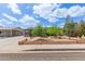 Charming single-story home with mature trees and a landscaped front yard at 313 W Utopia Rd, Phoenix, AZ 85027