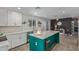 Bright kitchen with white cabinets, quartz countertops, and a large island at 313 W Utopia Rd, Phoenix, AZ 85027