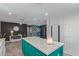 Open kitchen showcasing white cabinets, quartz countertops, and an island at 313 W Utopia Rd, Phoenix, AZ 85027