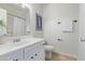 Bathroom featuring a single sink vanity and framed mirror over a toilet and shower at 3511 E Baseline Rd # 1214, Phoenix, AZ 85042