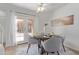 Cozy dining area with a round table, stylish chairs, and natural light from the patio doors at 3511 E Baseline Rd # 1214, Phoenix, AZ 85042