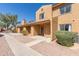 Exterior view of a tan two-story home with a terracotta roof at 3511 E Baseline Rd # 1214, Phoenix, AZ 85042