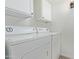 Bright laundry room with a side-by-side white washer and dryer at 3511 E Baseline Rd # 1214, Phoenix, AZ 85042