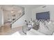 Bright living room with staircase, modern decor, and comfortable seating arrangement at 3511 E Baseline Rd # 1214, Phoenix, AZ 85042