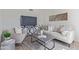 Inviting living room featuring a sofa, chair, modern TV, and decorative accents at 3511 E Baseline Rd # 1214, Phoenix, AZ 85042