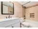 Updated bathroom featuring a shower-over-tub with tiled surround and a modern vanity at 3540 E Dolphin Ave, Mesa, AZ 85204