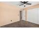 Bedroom with double door closet and an open entrance to an ensuite bathroom at 3540 E Dolphin Ave, Mesa, AZ 85204