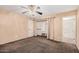 Bedroom with fan, closet, and ensuite bathroom, offering convenience and privacy at 3540 E Dolphin Ave, Mesa, AZ 85204