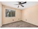 Bedroom with a ceiling fan, a window and carpeted floor at 3540 E Dolphin Ave, Mesa, AZ 85204