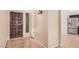 Entryway features a wood front door, neutral walls, and tile flooring, flowing seamlessly into the home's interior at 3540 E Dolphin Ave, Mesa, AZ 85204