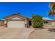 Charming single-story home featuring a two-car garage, neutral stucco and a well-manicured front yard in a suburban neighborhood at 3540 E Dolphin Ave, Mesa, AZ 85204