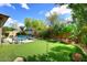 Backyard with pool, putting green, desert landscaping, and blue skies at 35707 N 34Th Ln, Phoenix, AZ 85086