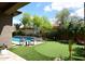 Backyard featuring pool, putting green and desert landscaping at 35707 N 34Th Ln, Phoenix, AZ 85086