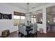 Charming dining room with modern lighting, a table with seating for six, and bright windows at 35707 N 34Th Ln, Phoenix, AZ 85086