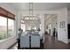 Elegant dining area boasting modern decor, a large window, and easy access to other living spaces at 35707 N 34Th Ln, Phoenix, AZ 85086