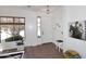 Bright foyer showcasing a stylish door, hardwood floors, and contemporary decor at 35707 N 34Th Ln, Phoenix, AZ 85086