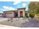 Beautiful home showcasing desert landscaping, a stone facade, and a two-car garage at 35707 N 34Th Ln, Phoenix, AZ 85086