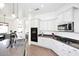 Beautiful kitchen features white cabinets, modern appliances, and granite countertops at 35707 N 34Th Ln, Phoenix, AZ 85086