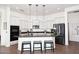 Bright kitchen features white cabinets, granite countertops, and stainless steel appliances at 35707 N 34Th Ln, Phoenix, AZ 85086