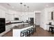 Bright kitchen features white cabinets, granite countertops, and stainless steel appliances at 35707 N 34Th Ln, Phoenix, AZ 85086