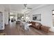 Open-concept living room with hardwood floors, a plush sofa, and abundant natural light at 35707 N 34Th Ln, Phoenix, AZ 85086