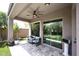 Covered patio with stone flooring, ceiling fan, and seating at 35707 N 34Th Ln, Phoenix, AZ 85086