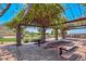 Covered picnic area with tables, providing a comfortable space for outdoor dining and gatherings at 35707 N 34Th Ln, Phoenix, AZ 85086