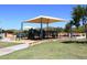 Shaded playground area with slides and climbing structures for children to enjoy at 35707 N 34Th Ln, Phoenix, AZ 85086