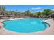 Community pool with lounge chairs, perfect for relaxation and recreation in a scenic outdoor setting at 35707 N 34Th Ln, Phoenix, AZ 85086