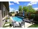 Sparkling pool with desert landscaping, lounge chairs, and blue sky at 35707 N 34Th Ln, Phoenix, AZ 85086