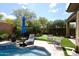 Backyard featuring a pool and putting green at 35707 N 34Th Ln, Phoenix, AZ 85086