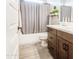 Bathroom featuring a shower and tub combination and a modern vanity at 3879 E Harrison St, Gilbert, AZ 85295
