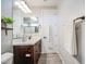 This bathroom features a white countertop, dark cabinets, and a neutral color scheme at 3879 E Harrison St, Gilbert, AZ 85295