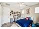 This bedroom features a clean design, unique decor, and neutral walls at 3879 E Harrison St, Gilbert, AZ 85295