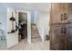 Bright entryway with custom closet and stairwell access to the upper floor at 3879 E Harrison St, Gilbert, AZ 85295