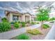Well-kept front yard with lush landscaping leading to a charming single-story home with great curb appeal at 3879 E Harrison St, Gilbert, AZ 85295