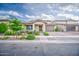 Charming single-story home showcasing desert landscaping, a two-car garage, and inviting curb appeal at 3879 E Harrison St, Gilbert, AZ 85295