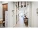 A long hallway with decorative elements and wood-look tile flooring at 3879 E Harrison St, Gilbert, AZ 85295