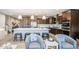 Inviting kitchen with an island and seating that leads into living area, creating a comfortable atmosphere at 3879 E Harrison St, Gilbert, AZ 85295