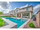 Inviting backyard featuring a sparkling pool, patio, and lush landscaping perfect for outdoor entertaining at 3879 E Harrison St, Gilbert, AZ 85295